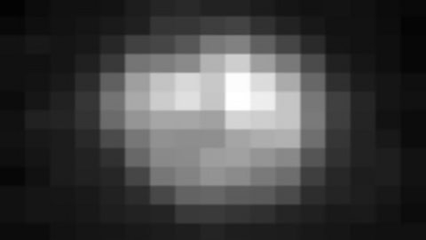 A pixelated photograph of Pluto 