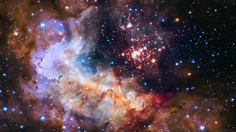 The Hubble telescope uses near-infrared to see through clouds of dust and took this image of the stars and nebula beyond. This allows scientists to learn about the make-up of distant planets and stars, and observe their formation. 