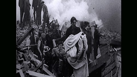 Belfast residents escaping the wreckage of their homes after a bombing raid