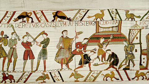 Norman troops erecting castles at Pevensey and Hastings.