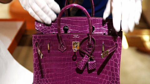 Getty Images As more middle-class consumers own big TVs and fancy handbags, the rich are looking for different ways to show off their social position (Credit: Getty Images)