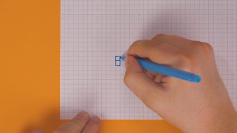 Someone drawing another square on top of a square on squared paper