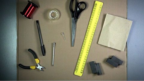 An image showing the items needed for the experiment such as a ruler, sandpaper, wire cutters, coil, sellotape, bar magnets and a pen