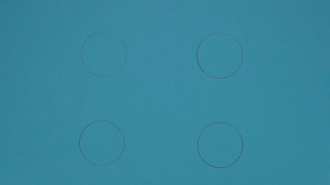 Four circles drawn on a piece of paper