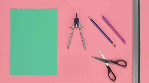 An image of paper, compass, scissors, ruler, pencil and a pen