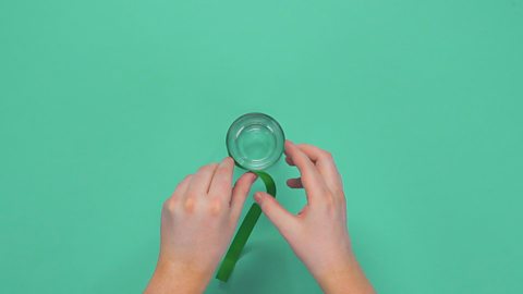 A drinking glass with ribbon