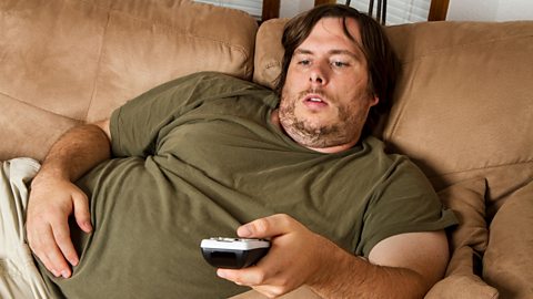 Overweight man on couch