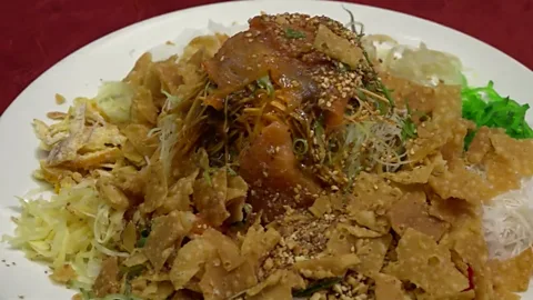 How to get rich tossing fish at Chinese New Year