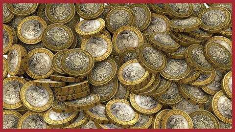 An image of many pound coins.