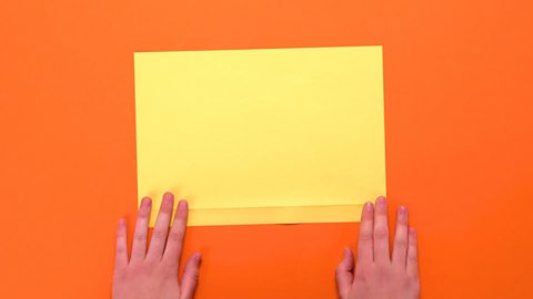 An A4 sheet of paper with a thin strip at the bottom folded over.