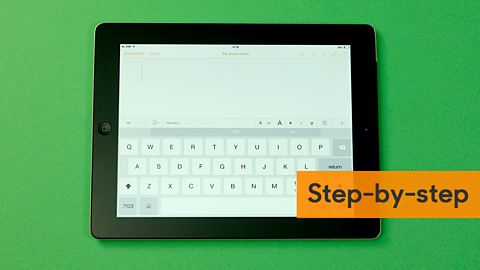 A touch screen keyboard and notepad open on a tablet.