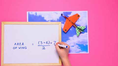 Toy plane and a formula for the area of its wing: (3 + 6) ÷ 2 × 7