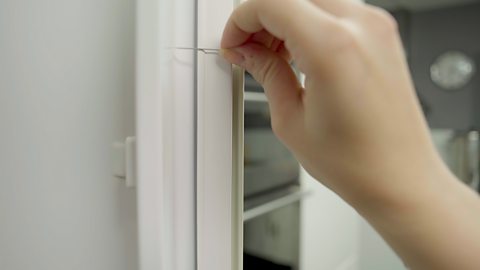 Rub the needle 50 times along the magnetic strip on a fridge door. Make sure you do this in one direction only.