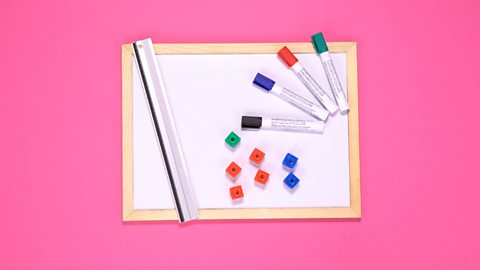 Whiteboard, ruler, coloured pens and counting cubes