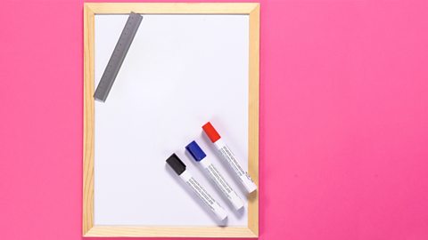 Whiteboard, ruler and coloured pens