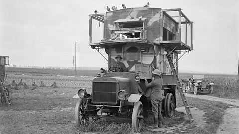 A former London motor bus camouflage-painted and used as a travelling loft for carrier pigeons Pernes 26 June 1918