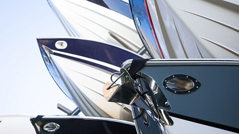 Modern speedboats lined up with glass-reinforced plastic (GRP) hulls and bows.