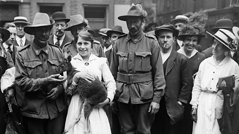 Australian and New Zealand Army Corps with their one year old pet kangaroo in 1916