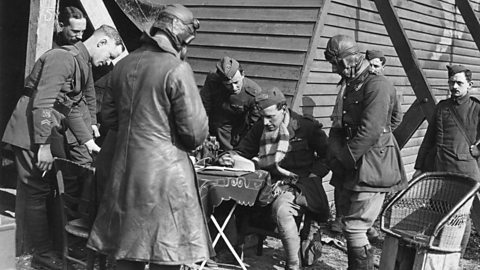 British pilots handing in reports after flying over enemy lines in World War One