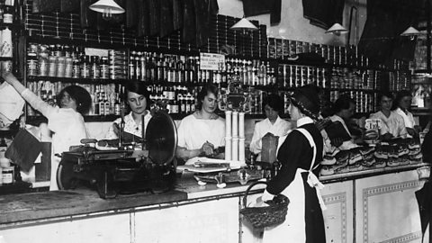 Women serving in a grocer's shop in August 1915