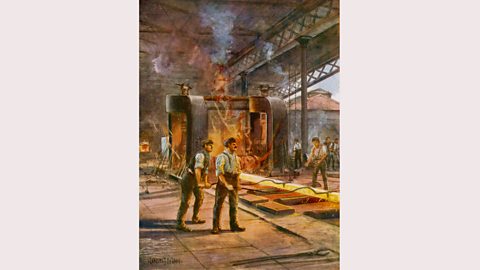 Steel workers rolling steel in a British steelworks in the early 1900s