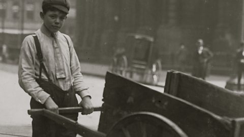 A delivery boy with a barrow in Britain in the early 1900s