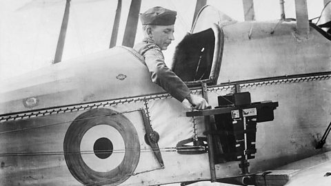 A sergeant of the Royal Flying Corps uses a reconnaissance camera fixed to his aircraft in 1916