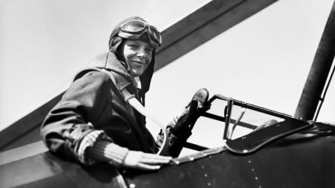 Pilot Amelia Earhart in the cockpit of her plane.