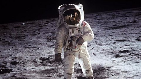 Buzz Aldrin walking on the moon during the Apollo 11 mission.