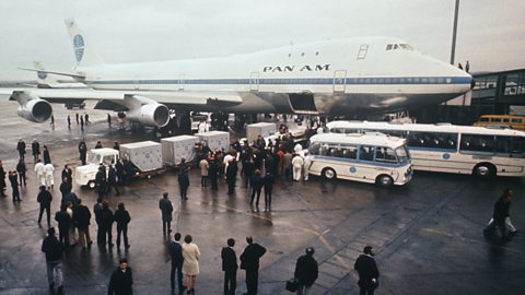 A Pan Am Boeing 747 sits on the runway.