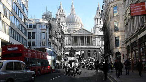 A modern London street with buses merged with early 1900s horse drawn buses