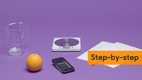 Image showing an orange, measuring jug, scales, calculator and sheets of paper