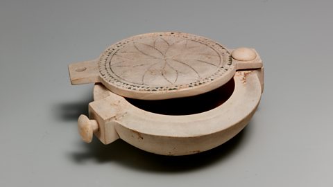 Pots like these were used to store make-up and cosmetics. Ancient Egyptians decorated their eyes with black kohl eyeliner. Both men and women painted their eyes.