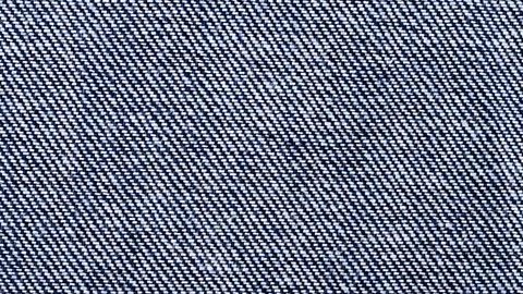 A close-up of a twill weave within denim jeans.