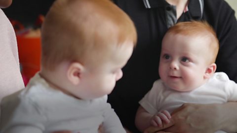 Baby boys listening to a song.