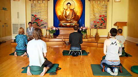 People meditating