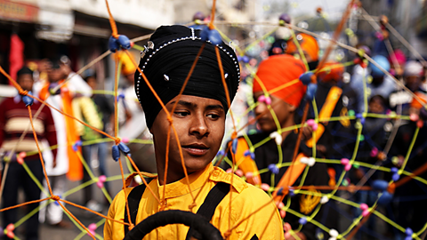 A young Indian Sikh taking part in a procession