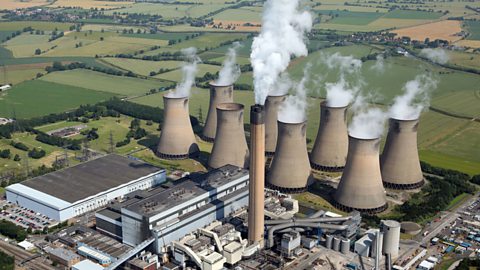 This is a coal power station in the UK. Coal is a fossil fuel which is often used for providing heat.