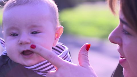 Mum pointing at baby's nose