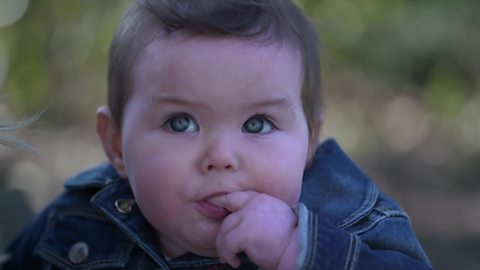 Baby listening to parent