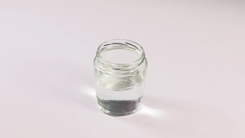 A jar half-filled with water.