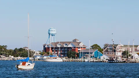 Boats on the water with buildings on Ocracoke Island in the background (Credit: Alamy)