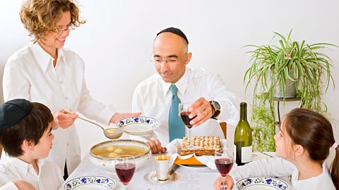 Family eating a Passover Seder meal.