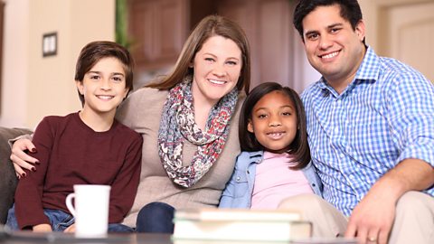 Family sitting in a living room