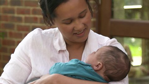 A mum cuddling her baby son.