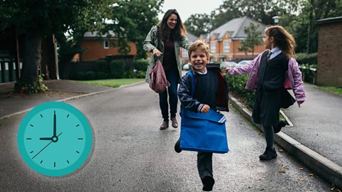 Children and their mum walking to school.