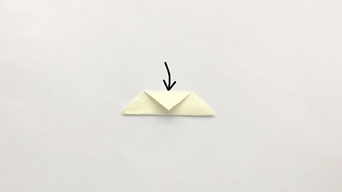 The top of the triangle is folded down towards its longest edge.