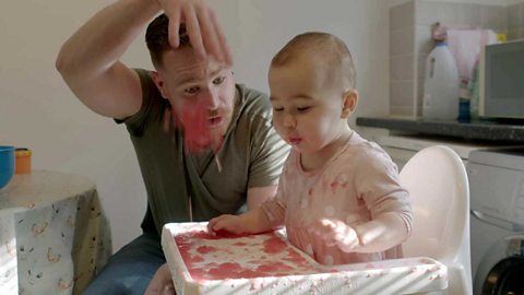 A dad dropping jelly for his daughter.