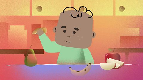 A cartoon baby picking up a sweet potato amongst a few different fruits and vegetables.