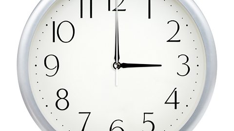 Image of a clock face showing 3.00